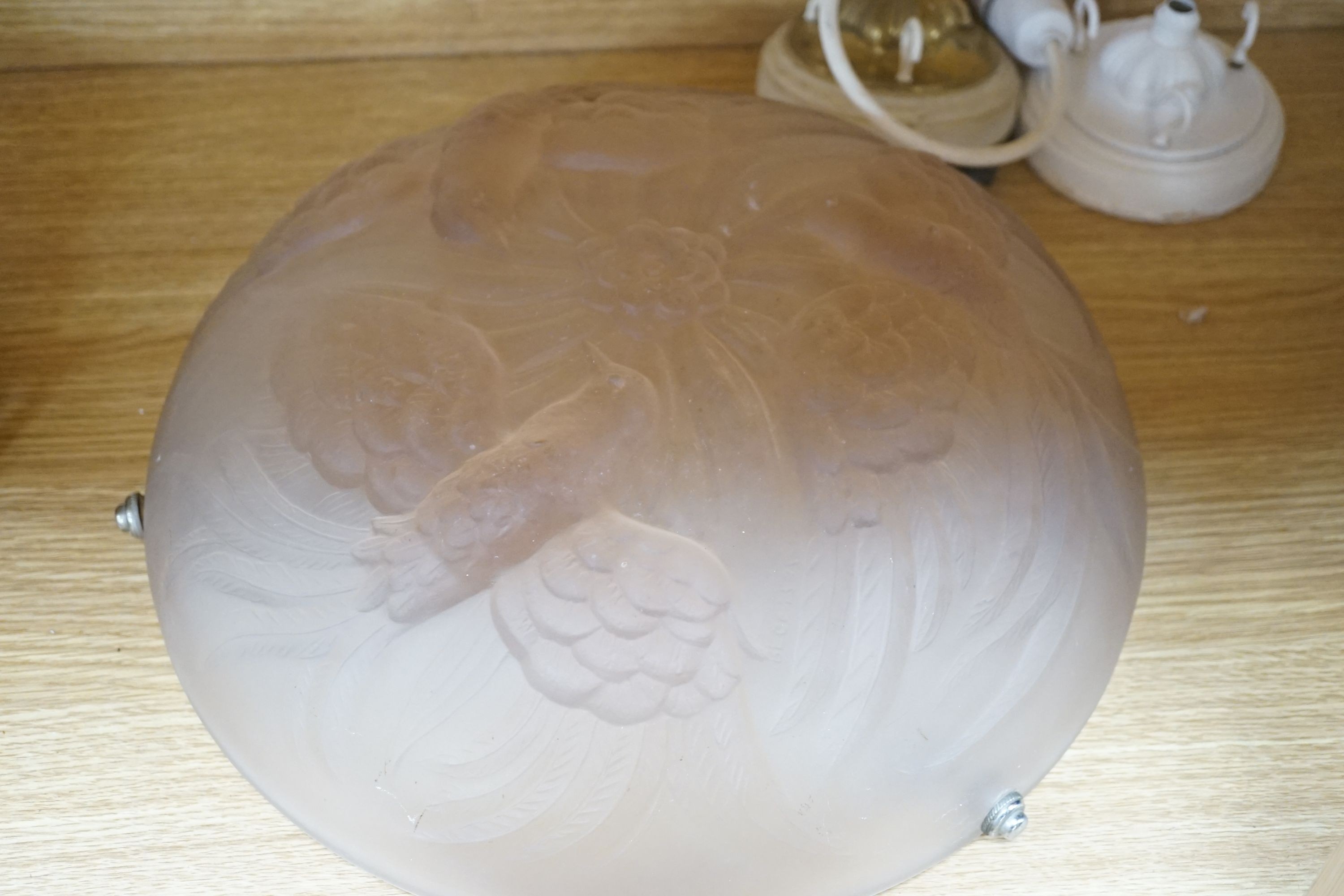 Two 1930s pink frosted glass plafonnier lights, one decorated with birds the other flowers, 36 cms diameter.